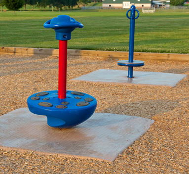 A Zeager Woodcarpet under a playground's spinning structure
