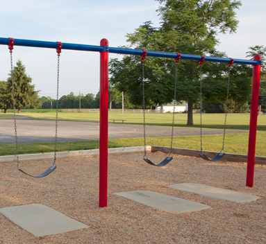 A Zeager WoodCarpet under a playground's swingset