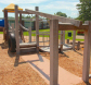 A Zeager WoodCarpet placed under a playground's monkey bars